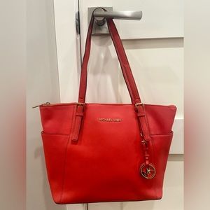 Michael Kors Jet Set Women’s Leather Travel Tote Handbag in Red